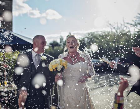 Bride and groom confetti shot