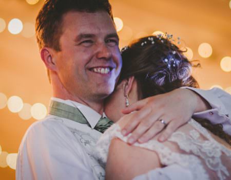 The bride and groom embrace