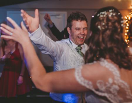 The bride and groom dancing