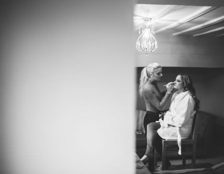 Bridesmaid having makeup done