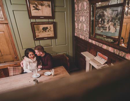 Intimate engagement photos in a pub