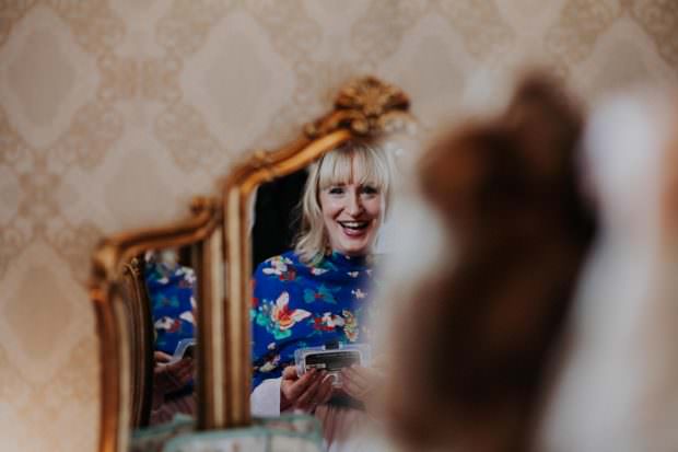 Bridesmaid having her hair done at Bassmead Manor Barn