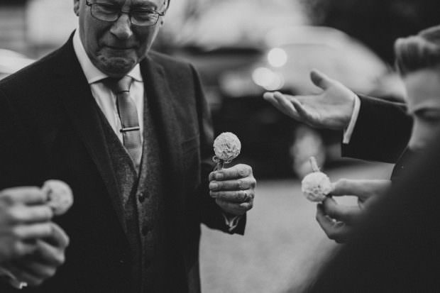 Men putting on their buttonholes