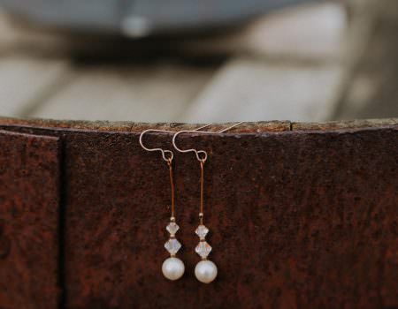 Bride's earrings hanging outside at Bassmead Manor Barn