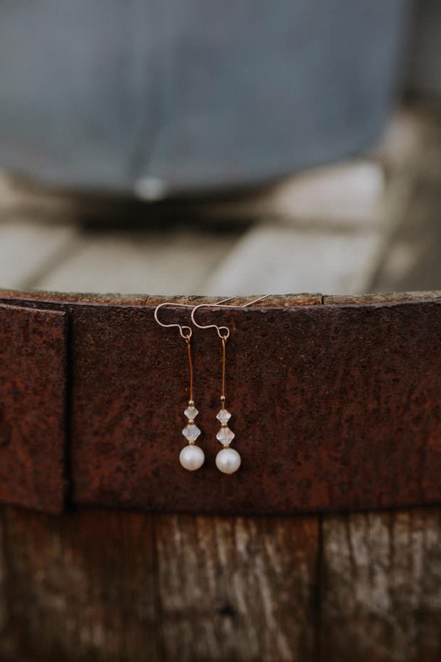 Bride's earrings hanging outside at Bassmead Manor Barn