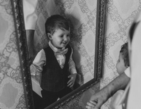 Pageboy looking in the mirror
