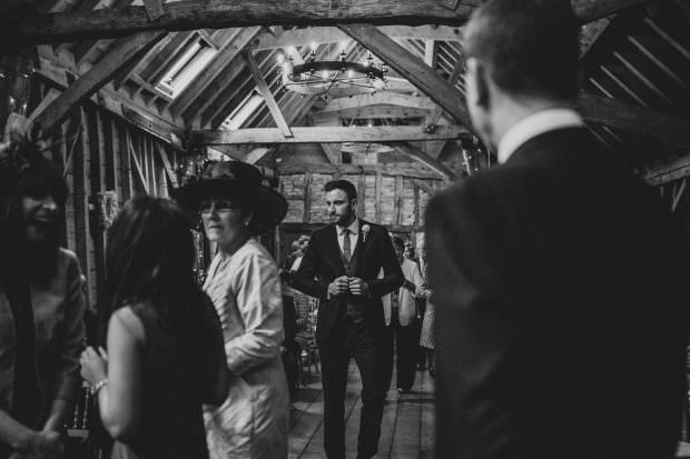 Groom coming in to the ceremony at Bassmead Manor Barn