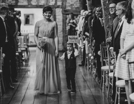 Pageboy with cute sign at ceremony