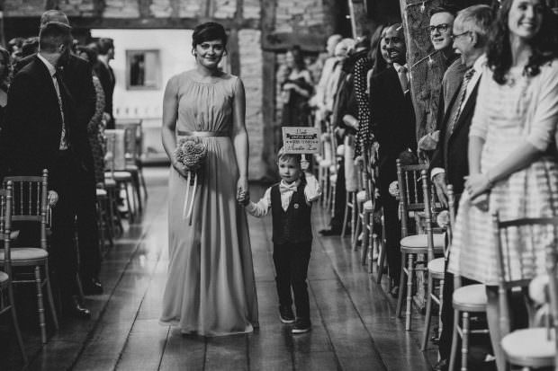 Pageboy with cute sign at ceremony
