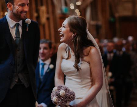 Bride and groom sharing a laugh during the ceremony