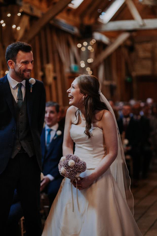 Bride and groom sharing a laugh during the ceremony