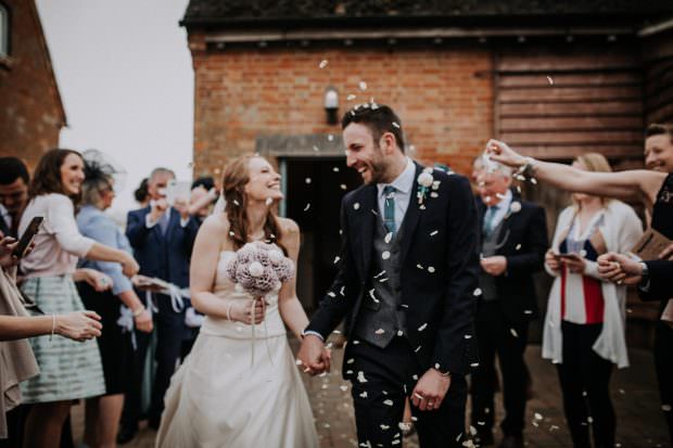 Bride and groom exit the ceremony to confetti
