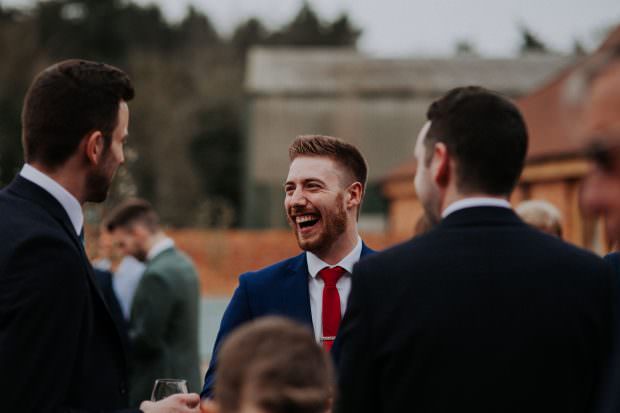 Guests having a laugh after the wedding