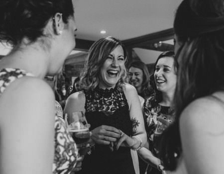 Guests laughing at Bassmead Manor Barn