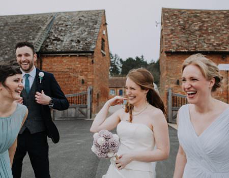 Bridal party sharing a joke