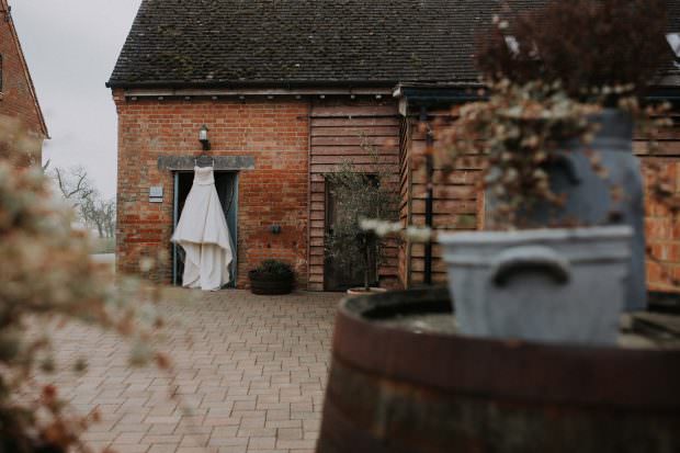 Wedding dress hanging at Bassmead Manor Barns