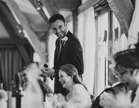 Groom making everyone laugh during the speeches at Bassmead Manor Barns
