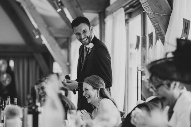 Groom making everyone laugh during the speeches at Bassmead Manor Barns