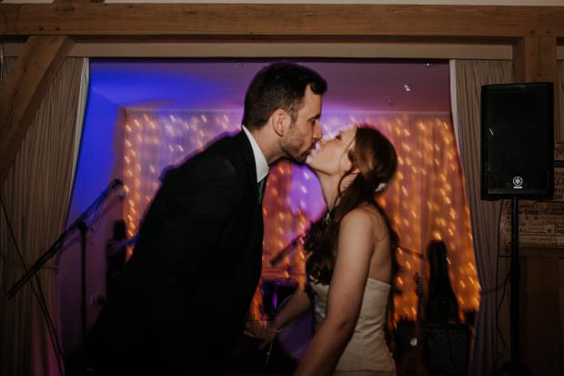 Bride and groom sharing a kiss on the dance floor