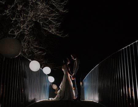 Night time portrait of bride and groom at Bassmead Manor Barns