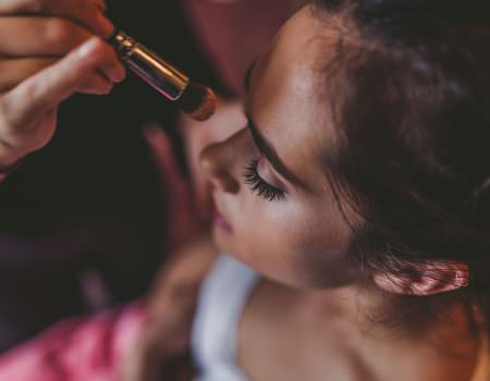 Bridesmaid having her makeup done