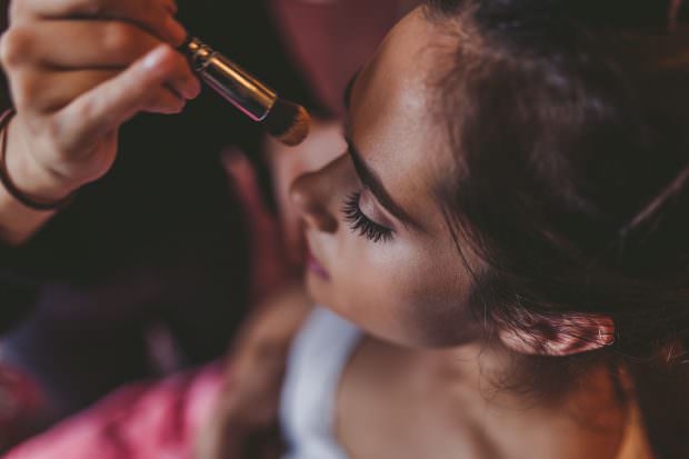 Bridesmaid having her makeup done