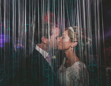 bride and groom kiss at wedding