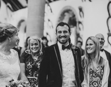 The brides son looks on