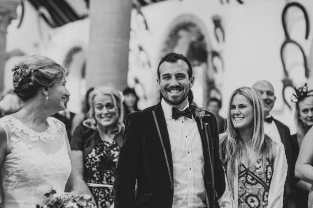 The brides son looks on