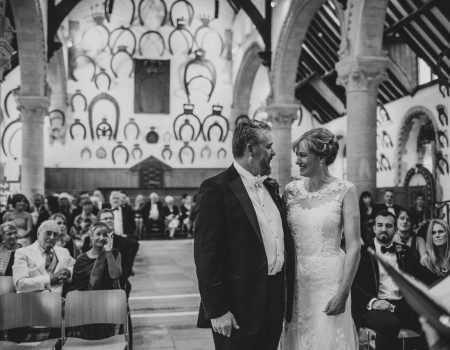 Bride and groom during wedding ceremony at Oakham Castle