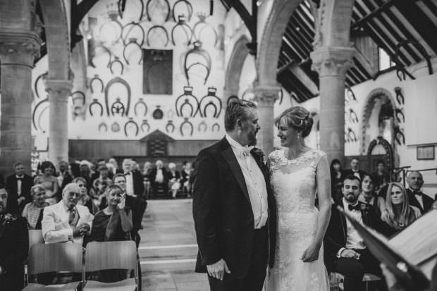 Bride and groom during wedding ceremony at Oakham Castle