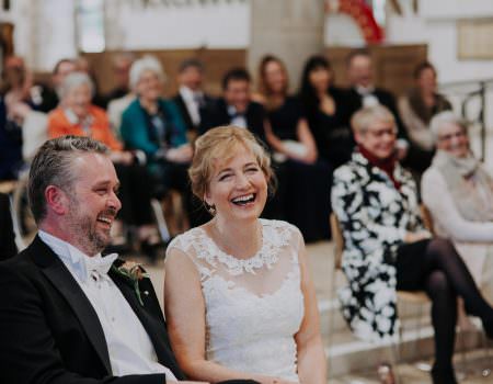 Bride enjoying reading at wedding