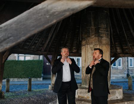 Groom and the batsman under the Buttercross