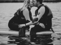 kiss on paddle boards